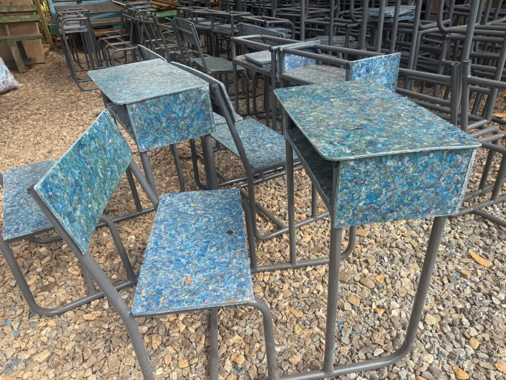 Students using recycled plastic furniture in modern classroom